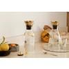 Carafe à eau 1 l, couvercle en laiton, verre, Eva Solo